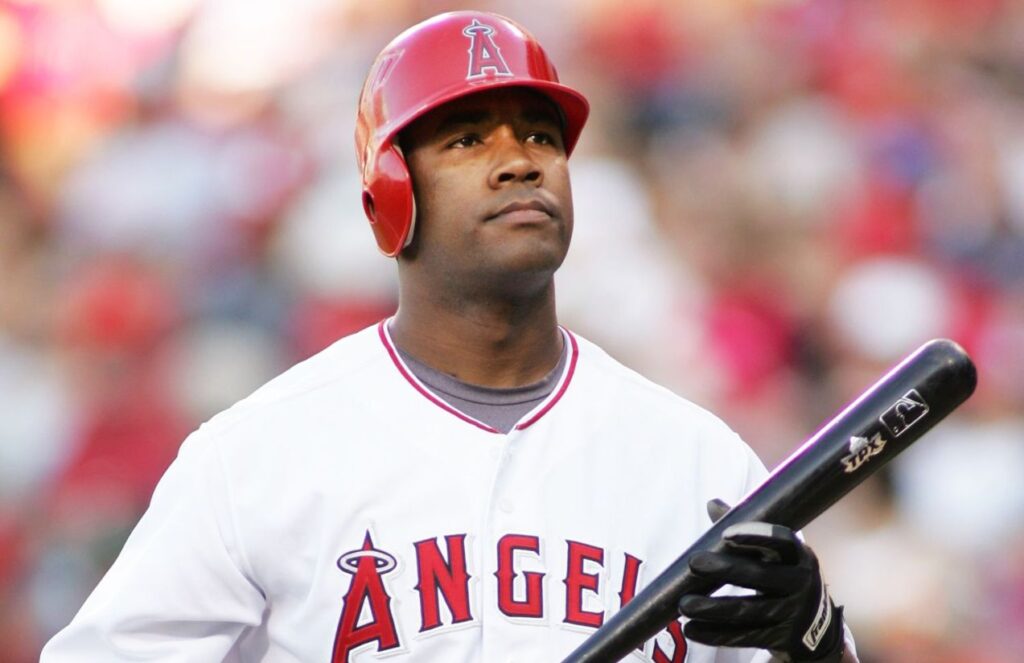 Anderson holding his bat while walking toward the batter’s box.