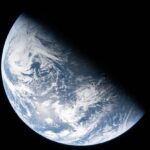 A photo of planet Earth showing the transition between night and day