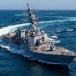 A U.S. warship sailing in the open sea.