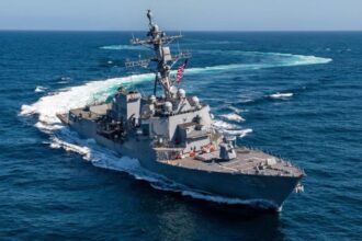 A U.S. warship sailing in the open sea.