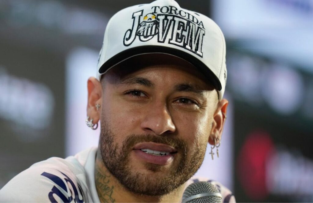 Neymar sitting in style at a press conference