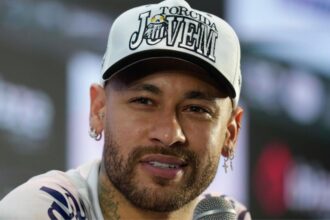 Neymar sitting in style at a press conference