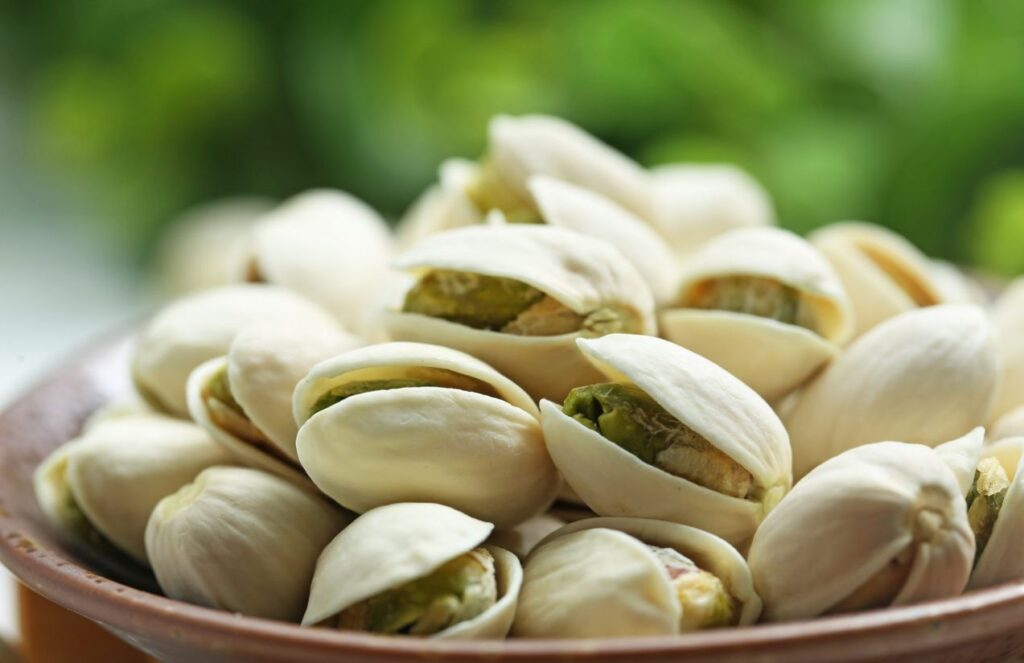 Pistachio prices surge Iran conflict drives costs to an eight-year high A bowl on a table filled with pistachios ready to eat.