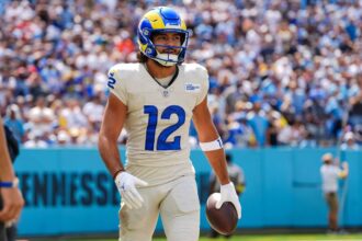 The Rams wide receiver holding the ball while walking with style after scoring