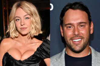 On one side, the actress, and on the other, the music executive, both posing for the cameras.