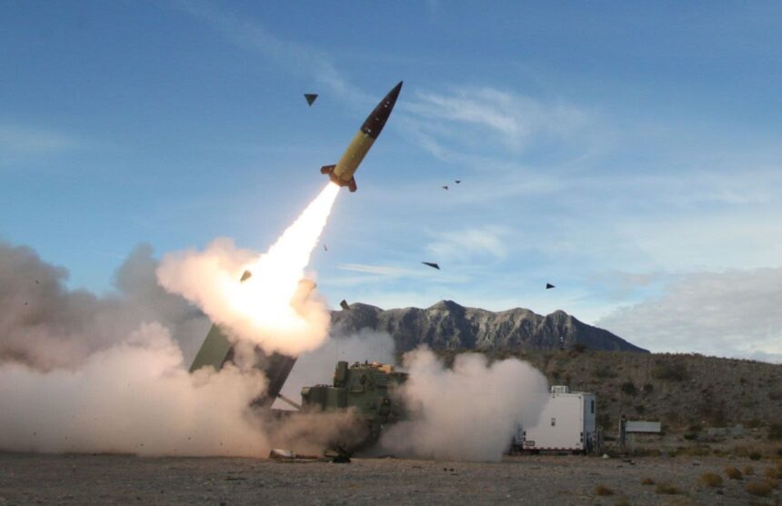 A Russian military vehicle carrying several missiles while one of them is being launched