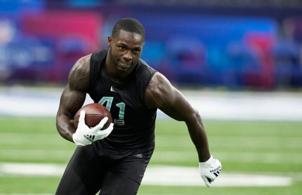 Scandal in the NFL Markquese Bell of the Dallas Cowboys arrested on drug charges The fast player from the Dallas Cowboys running while holding the ball during a practice.