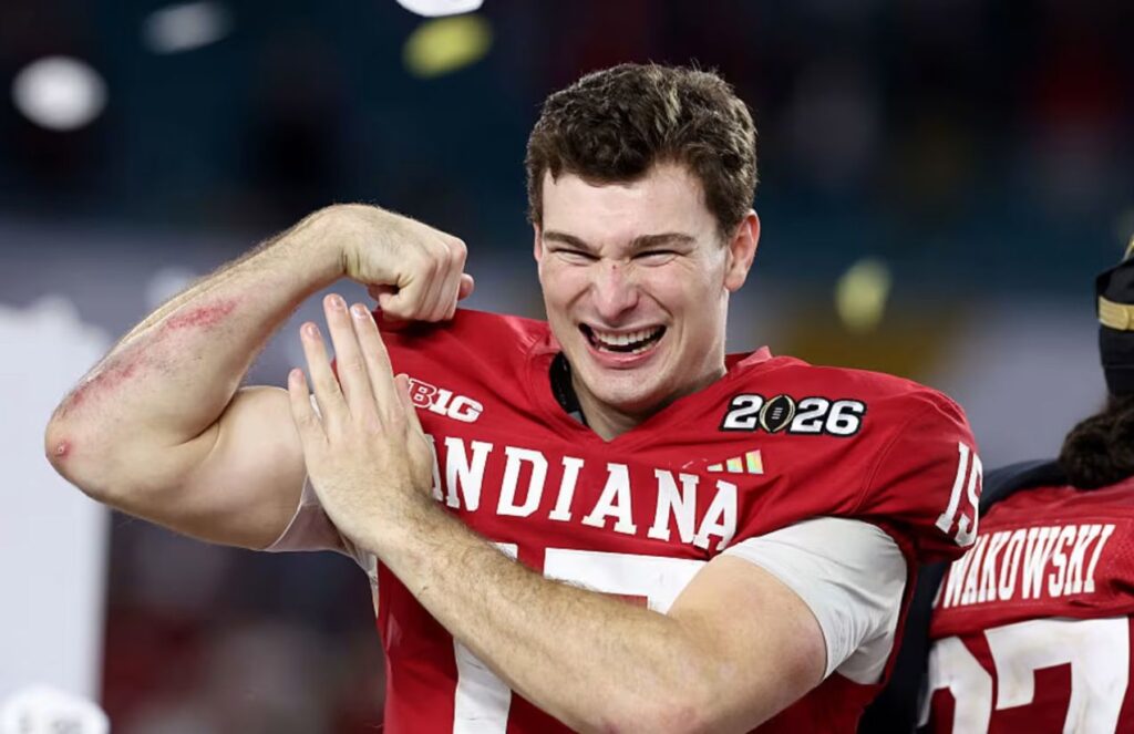 Fernando showing his strength to the crowd by flexing his arm muscles after winning a game.