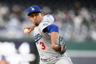 Díaz on the mound, about to throw the ball during a game.