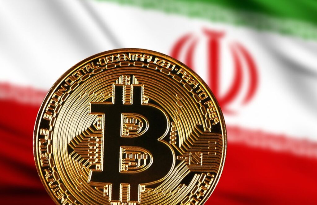 A Bitcoin coin in front of the Iran flag with its green, white, and red colors.