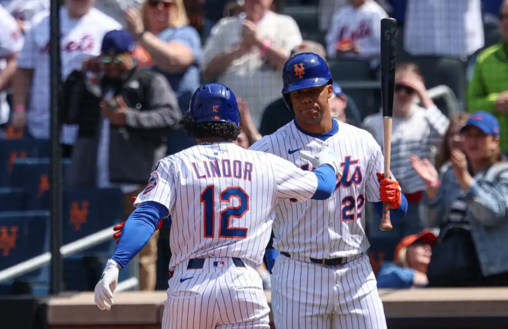 Lindor and Soto high-fiving before stepping into the batter’s box.