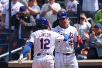 Lindor and Soto high-fiving before stepping into the batter’s box.