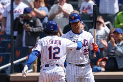 Lindor and Soto high-fiving before stepping into the batter’s box.