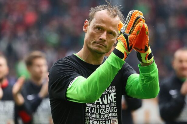 The legendary goalkeeper waving to the crowd after finishing a soccer match.