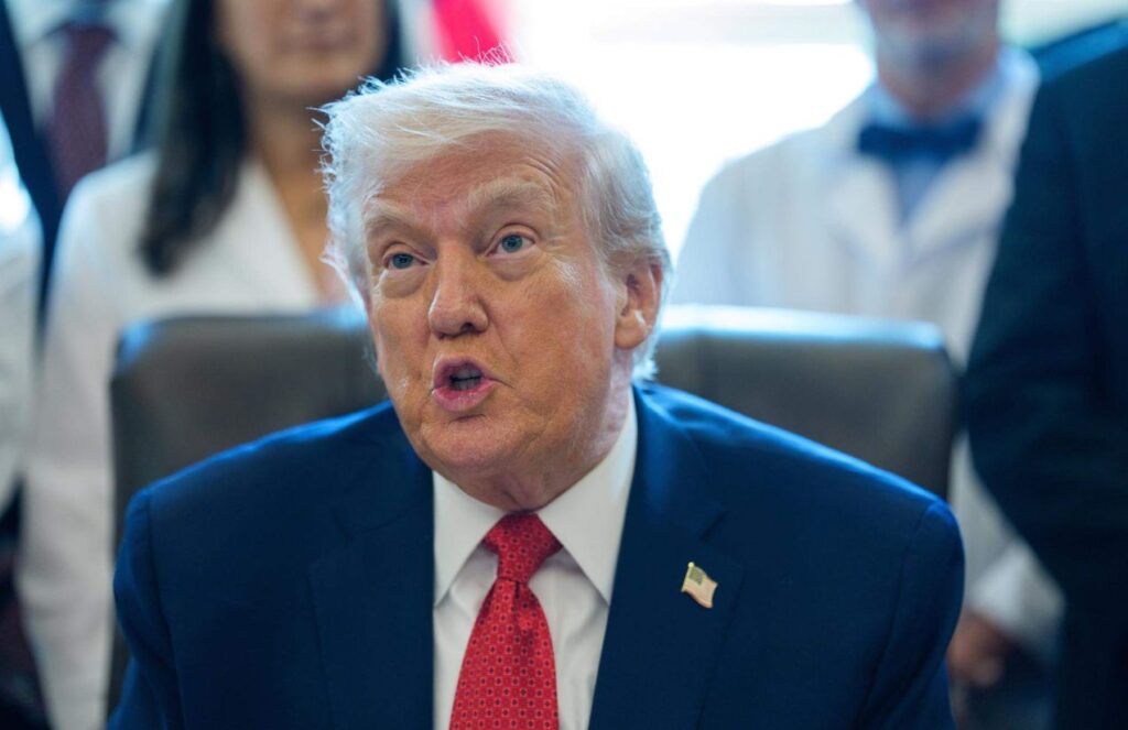 Donald Trump speaking with his supporters while sitting in his office