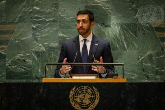 A representative of the United Arab Emirates standing at a podium presenting his point of view
