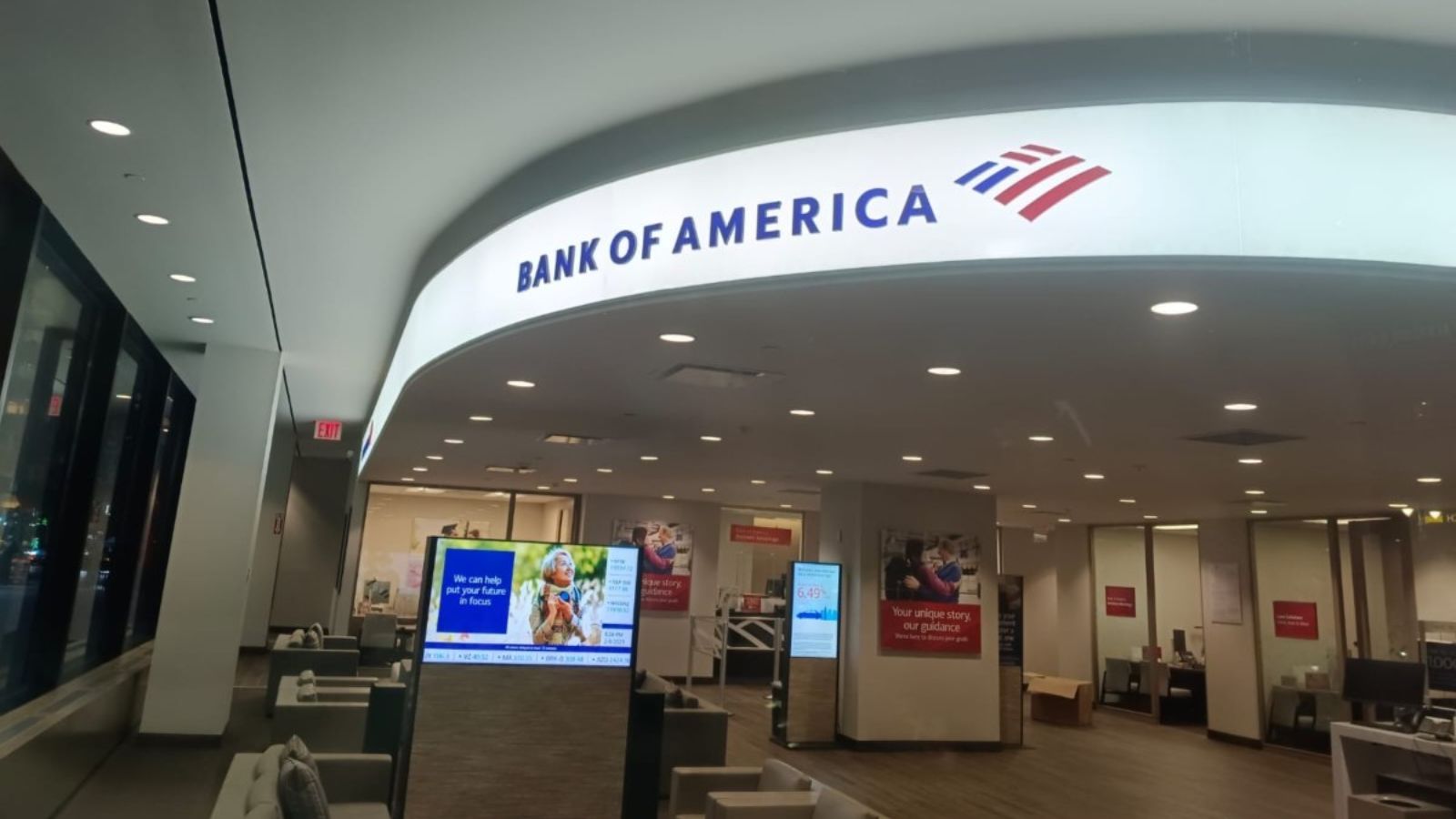 One of the Bank of America offices with several of its cubicles and the logo displayed above all of them