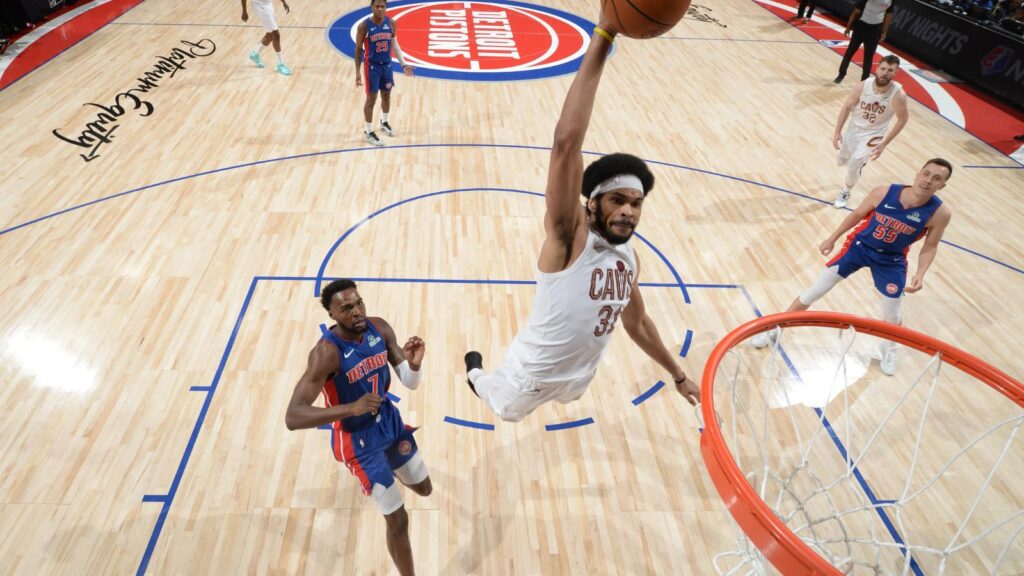 Cleveland Cavaliers survive Game 7 and eliminate the Detroit Pistons in a historic night Jarrett Allen of the Cleveland Cavaliers making a dunk while two Detroit Pistons players watch him rise into the air.