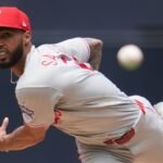 An image of the Dominican pitcher Cristopher Sánchez throwing a baseball in his pitching delivery stance.