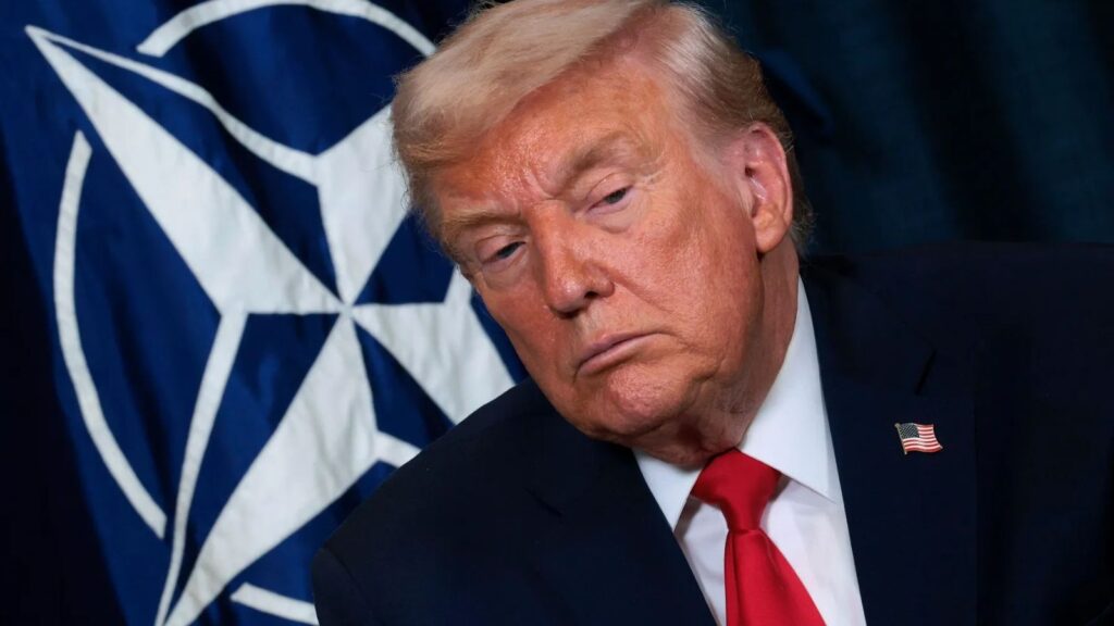 Donald Trump staring intensely at someone in the audience while asking or saying something.