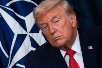Donald Trump staring intensely at someone in the audience while asking or saying something.