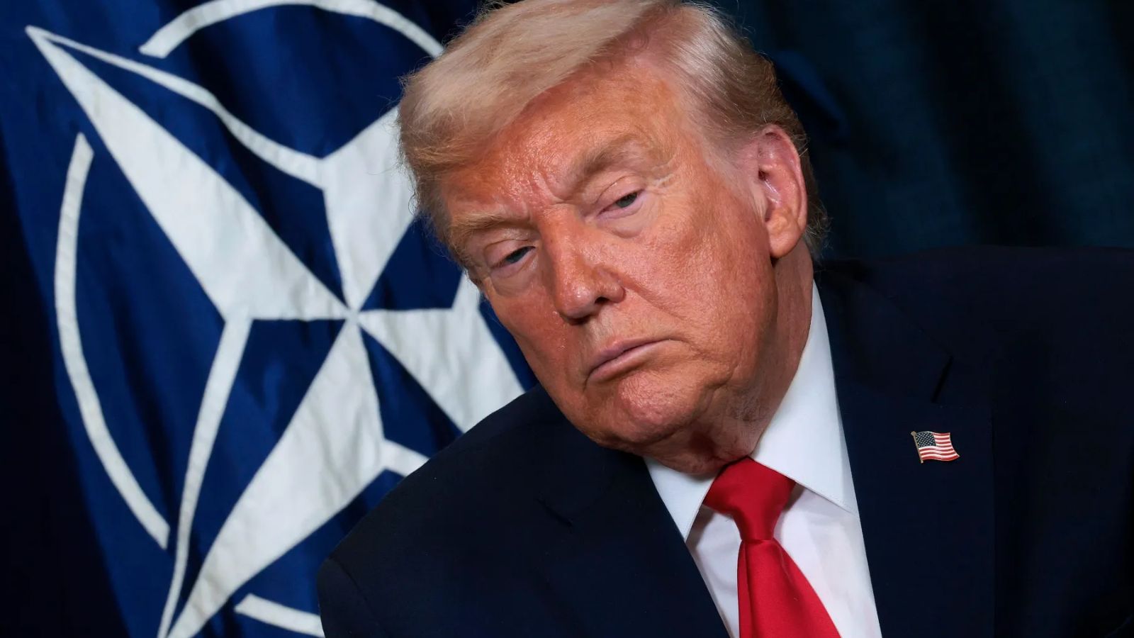 Donald Trump staring intensely at someone in the audience while asking or saying something.