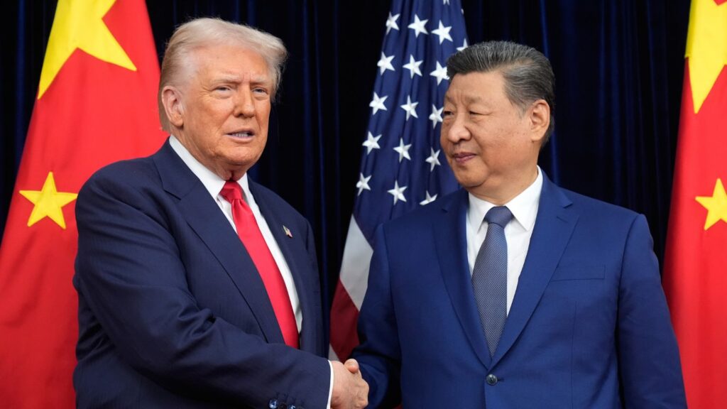 The top leaders of both world powers shaking hands while being photographed during a conversation.