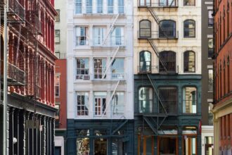 A panoramic image of houses and apartment buildings in New York City.