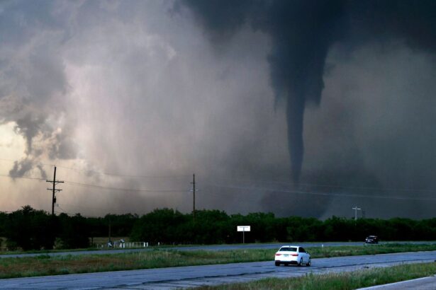 A storm turning into a small hurricane crossing a large field.