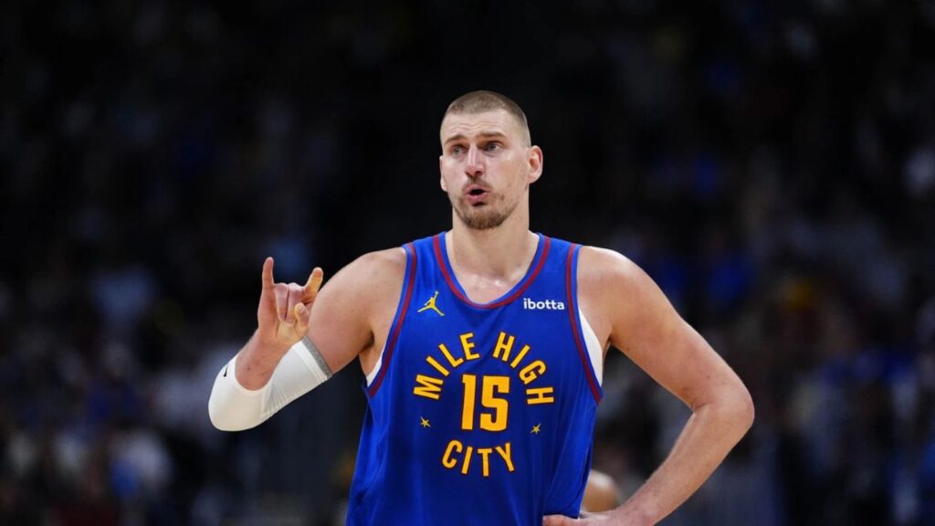 Nikola Jokic wearing his team’s blue uniform in the middle of an important game.