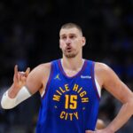Nikola Jokic wearing his team’s blue uniform in the middle of an important game.