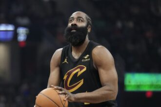The experienced Cleveland Cavaliers player at the free-throw line preparing to make a shot.