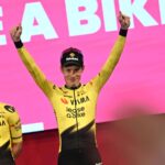 Jonas Vingegaard raising his arms in celebration after winning one of the stages of the Giro d'Italia.