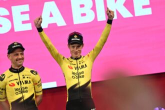 Jonas Vingegaard raising his arms in celebration after winning one of the stages of the Giro d'Italia.