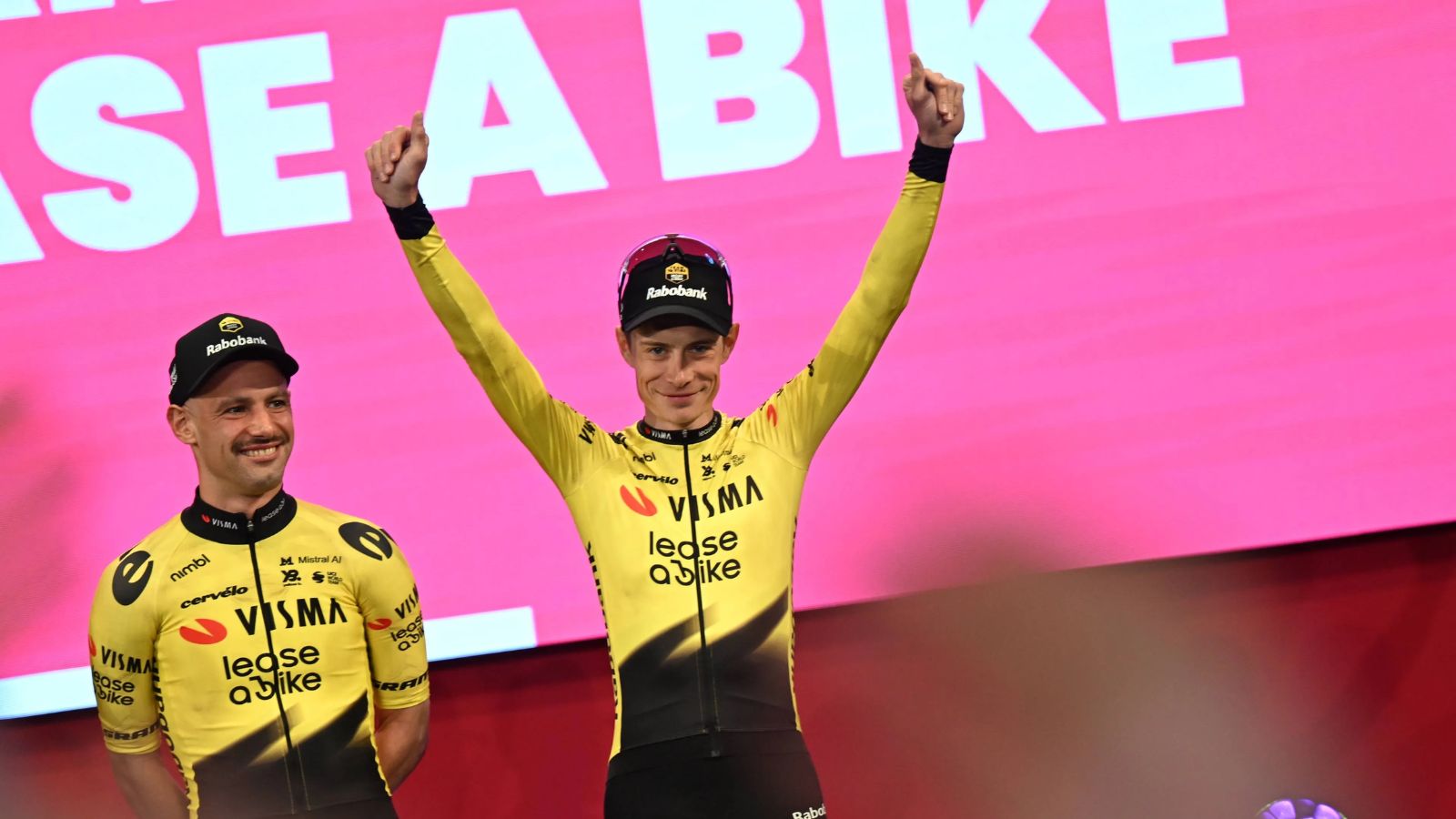 Jonas Vingegaard raising his arms in celebration after winning one of the stages of the Giro d'Italia.