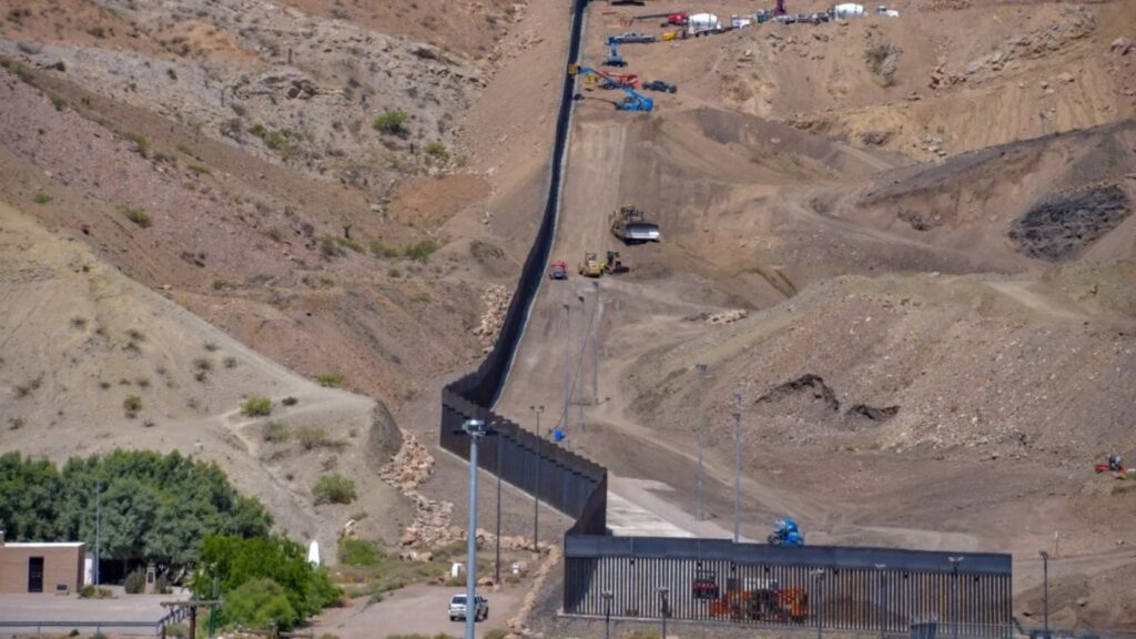 A panoramic view of several machines building Trump border wall that separates Mexico from Texas.