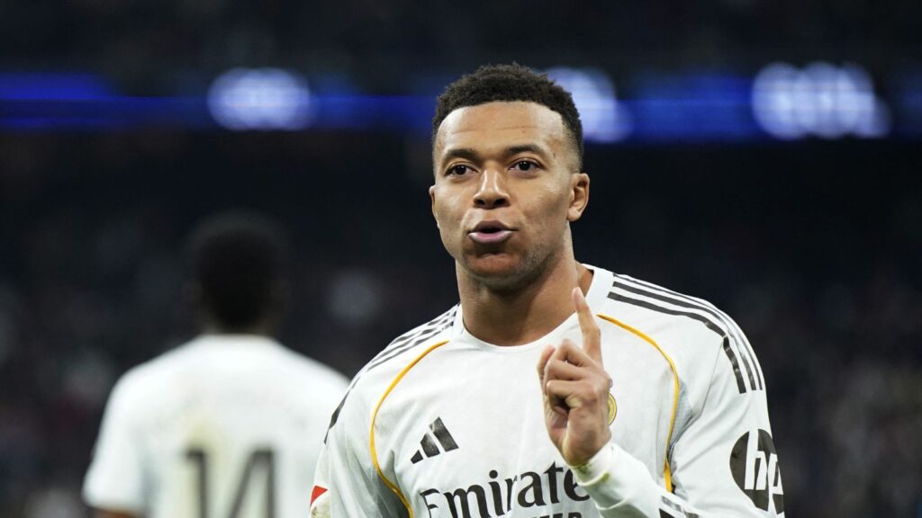 The excellent French player celebrating one of his goals while wearing Real Madrid’s white kit.