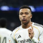 The excellent French player celebrating one of his goals while wearing Real Madrid’s white kit.