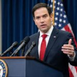 Marco Rubio giving a speech in front of a large audience.