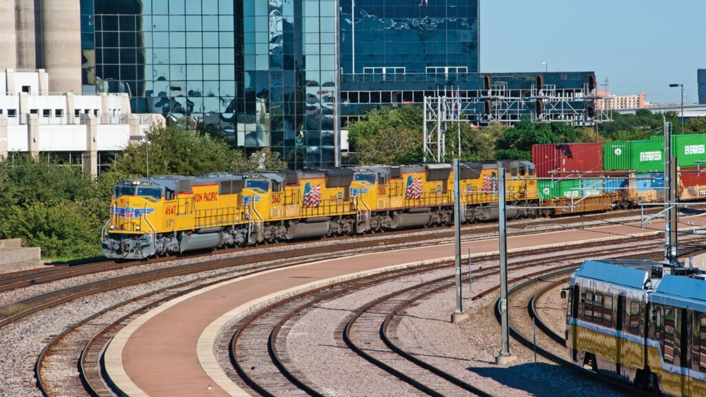 A train leaving a railway yard in Texas in the United States.