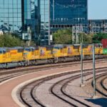 A train leaving a railway yard in Texas in the United States.