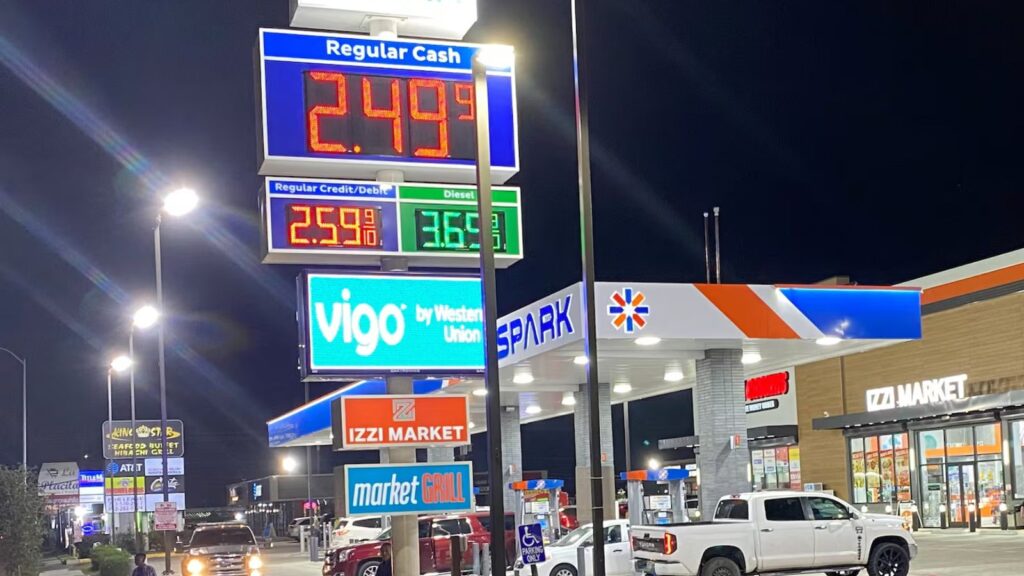 A gas station in the United States with vibrant colors and several cars refueling.