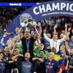 Paris Saint-Germain conquers Europe again and wins back-to-back Champions League titles The players carrying their coach on their shoulders while he holds the Champions League trophy.