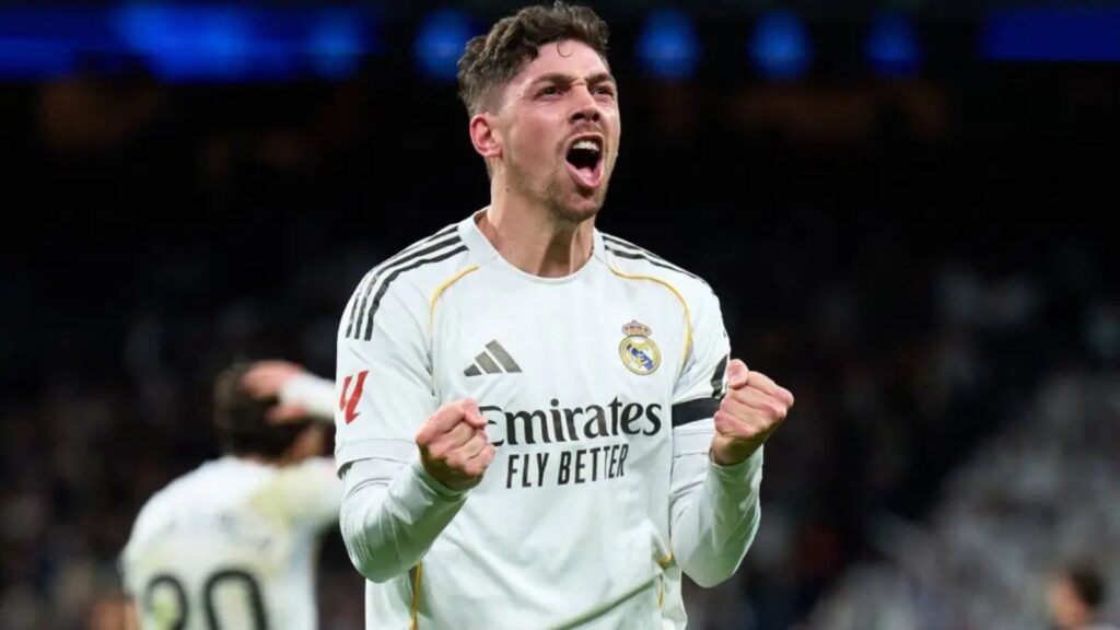 Federico Valverde celebrating euphorically and powerfully with both fists clenched.