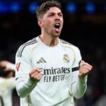 Federico Valverde celebrating euphorically and powerfully with both fists clenched.