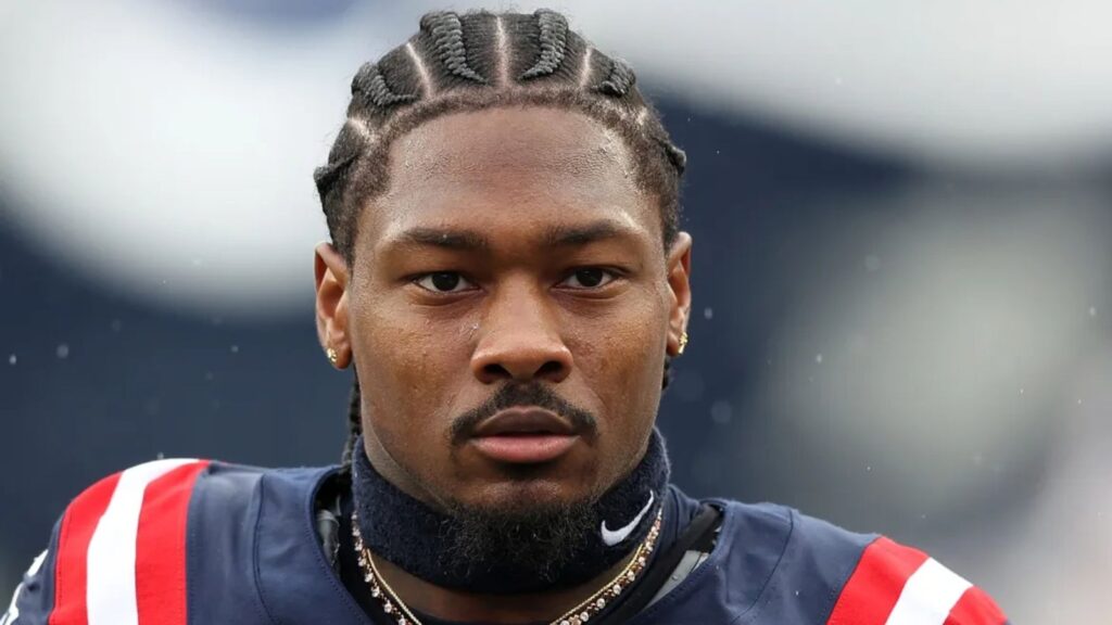 The well-known wide receiver wearing the New England Patriots uniform with a very serious expression before the start of a game.