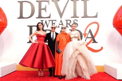 The stars of the iconic movie on a promotional red carpet for the same film.