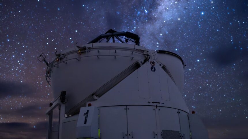 A large high-tech telescope in the middle of a Chilean field.