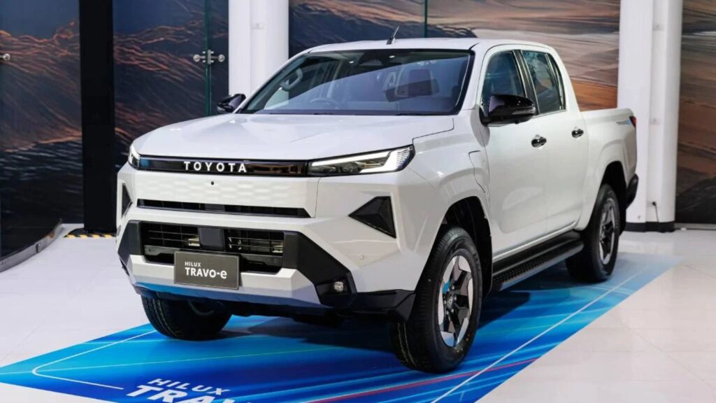A white Toyota Hilux displayed at a convention.