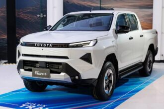 A white Toyota Hilux displayed at a convention.